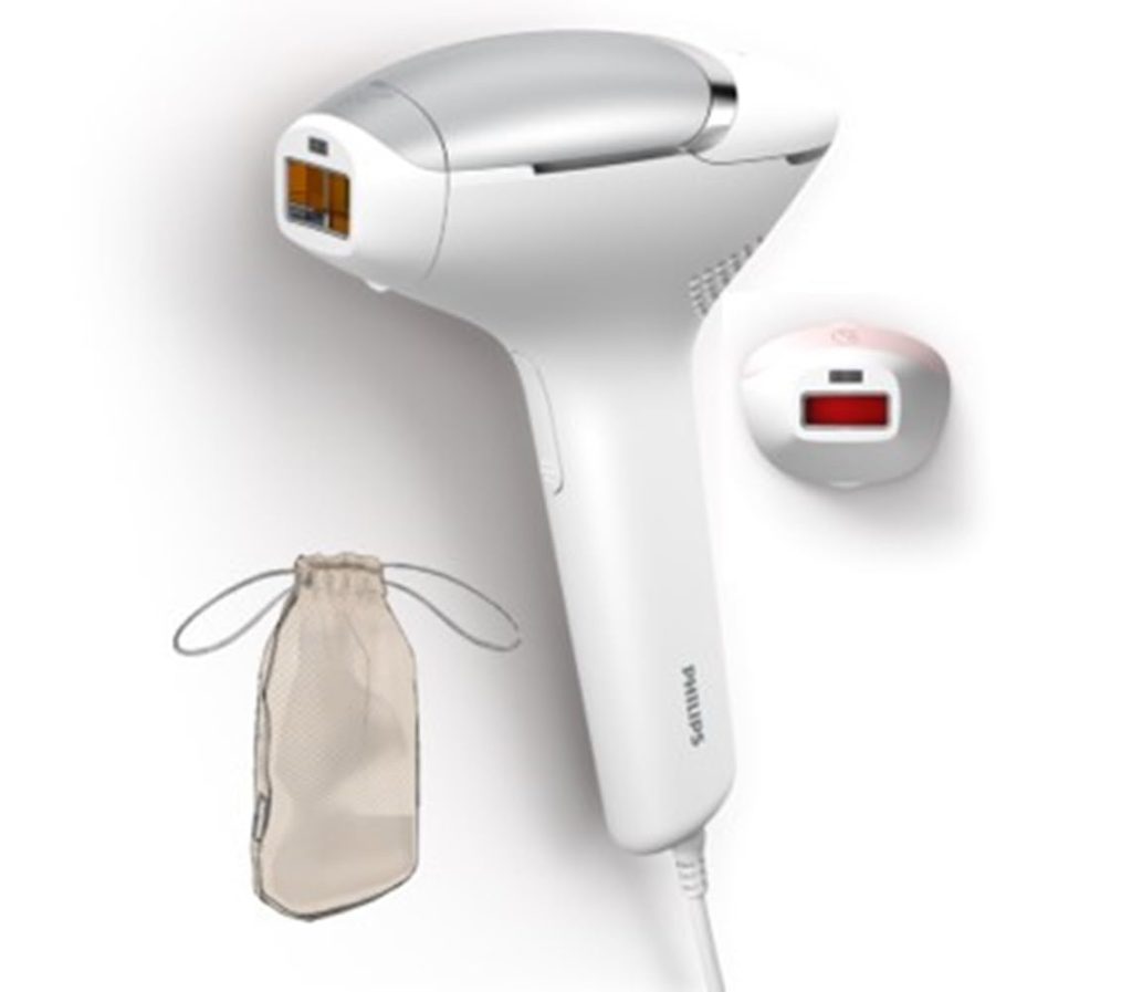 woman using Philips Lumea IPL 8000 on legs at home
